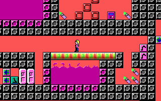 Keen stands on a bridge over noxious goo.